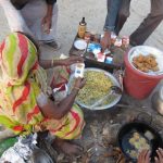 woman selling fried snacks in Bangladesh